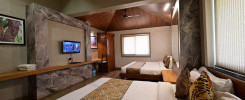 Luxury bedroom interior at one of the best Kanha Tiger Reserve hotels